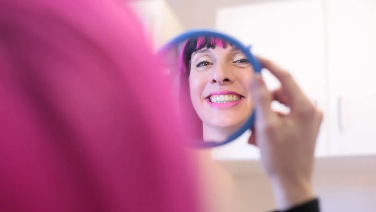 Patient smiling after orthodontics treatment