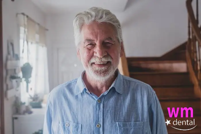 older gent with dental implant smile